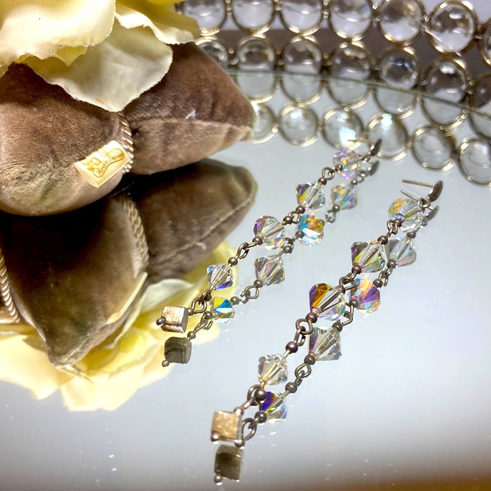 Long Swarovski earrings.